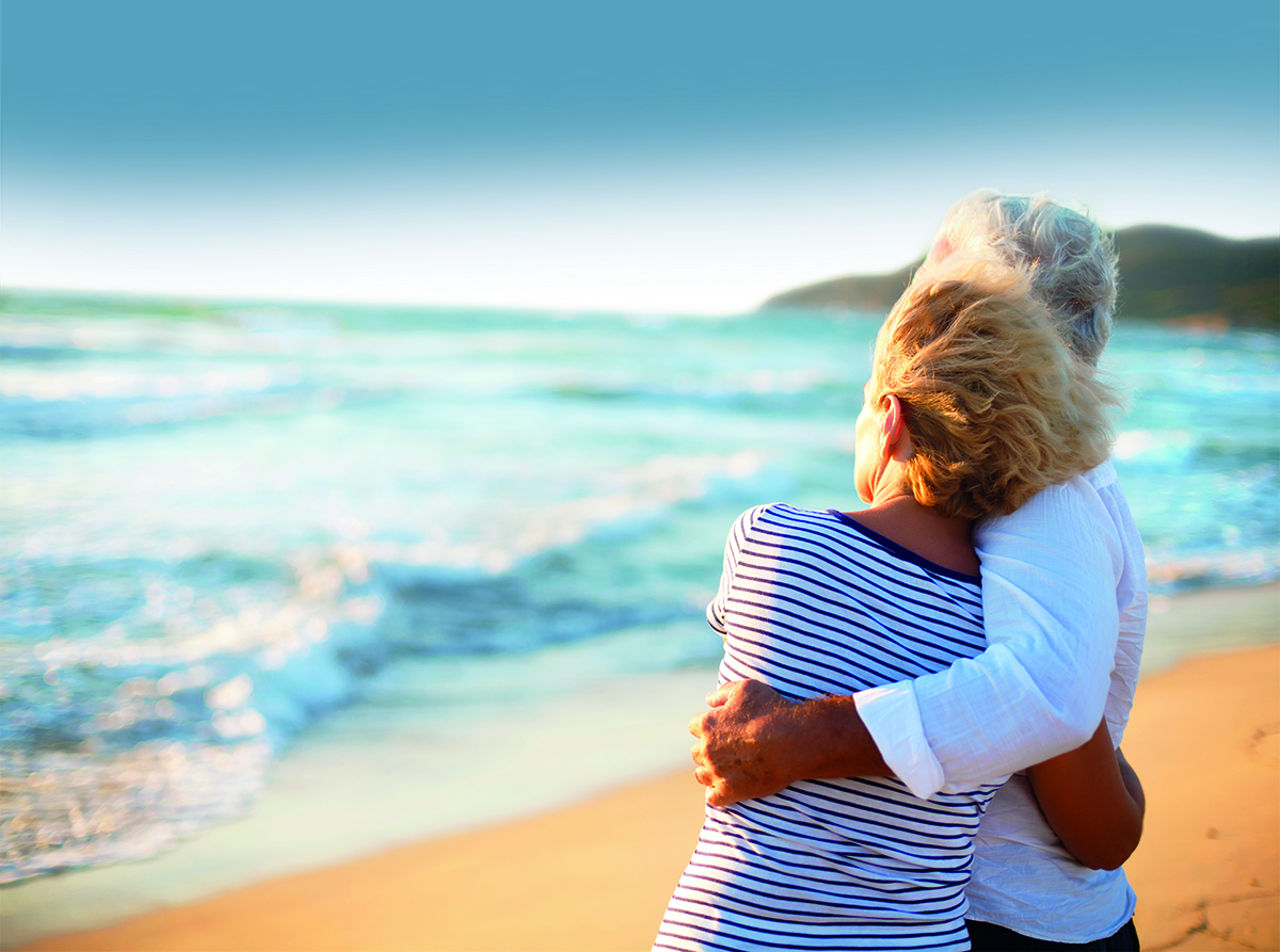 Couple embracing at the beach