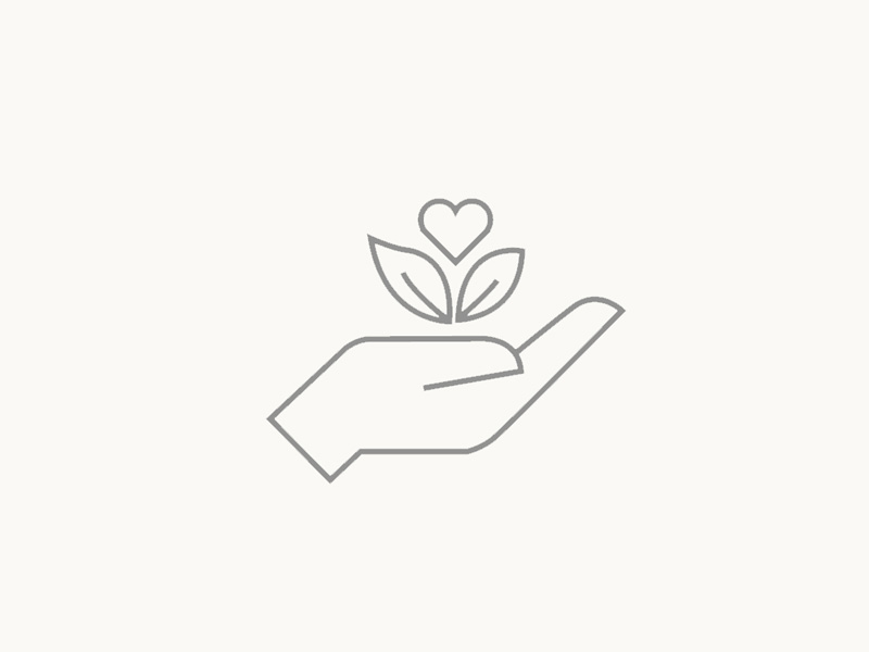 Um ícone representando uma mão segurando uma planta, simbolizando a sustentabilidade